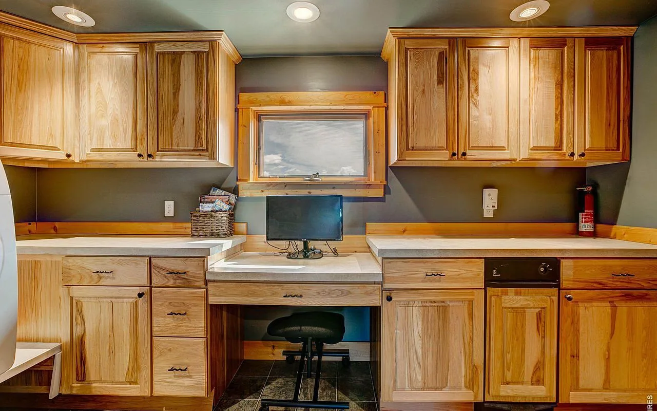 Built-in office nook with hickory cabinets, a quiet workspace in the lodge