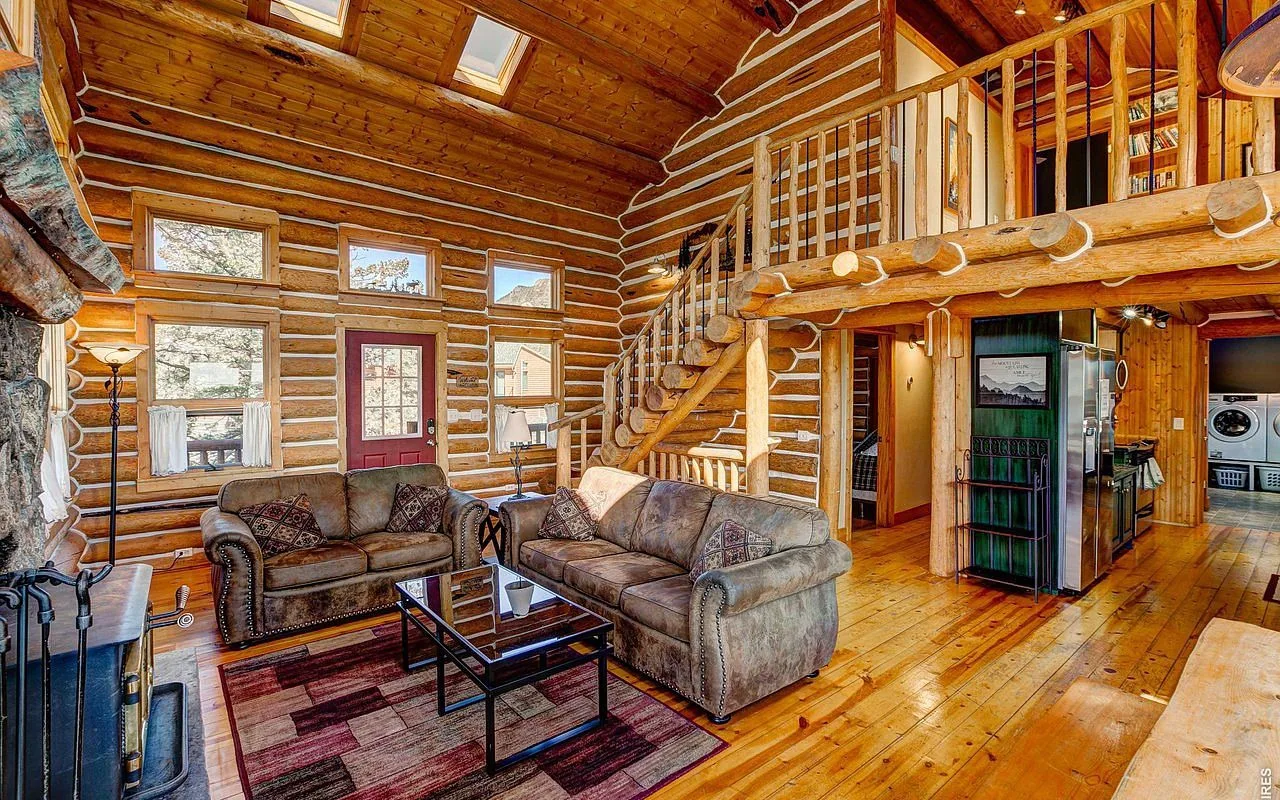 The vaulted great room of the log lodge at Range View on the Rocks